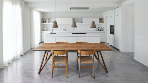 spacious dining room with pendant lights